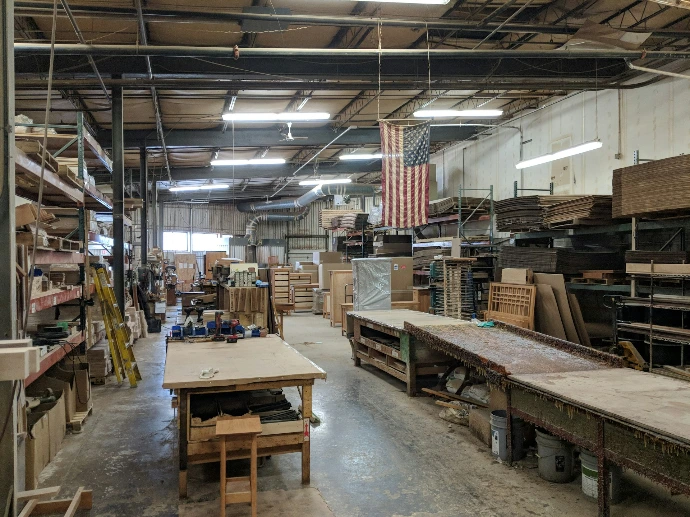 brown wooden table near hanging flag of U.S.A